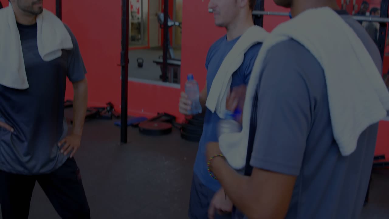 Gym mates finishing set discussing exercise while pointing at rack, HUD charts overlaying mirror
