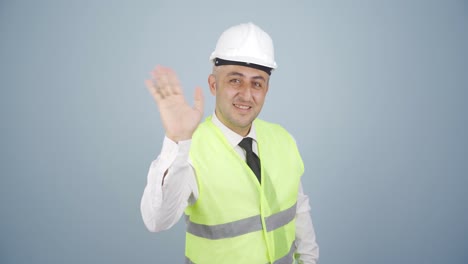 Engineer-waving-at-camera.
