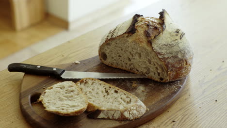 sliced homemade bread on wooden cutting board