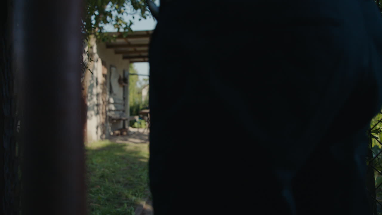 Man Walking in a Garden