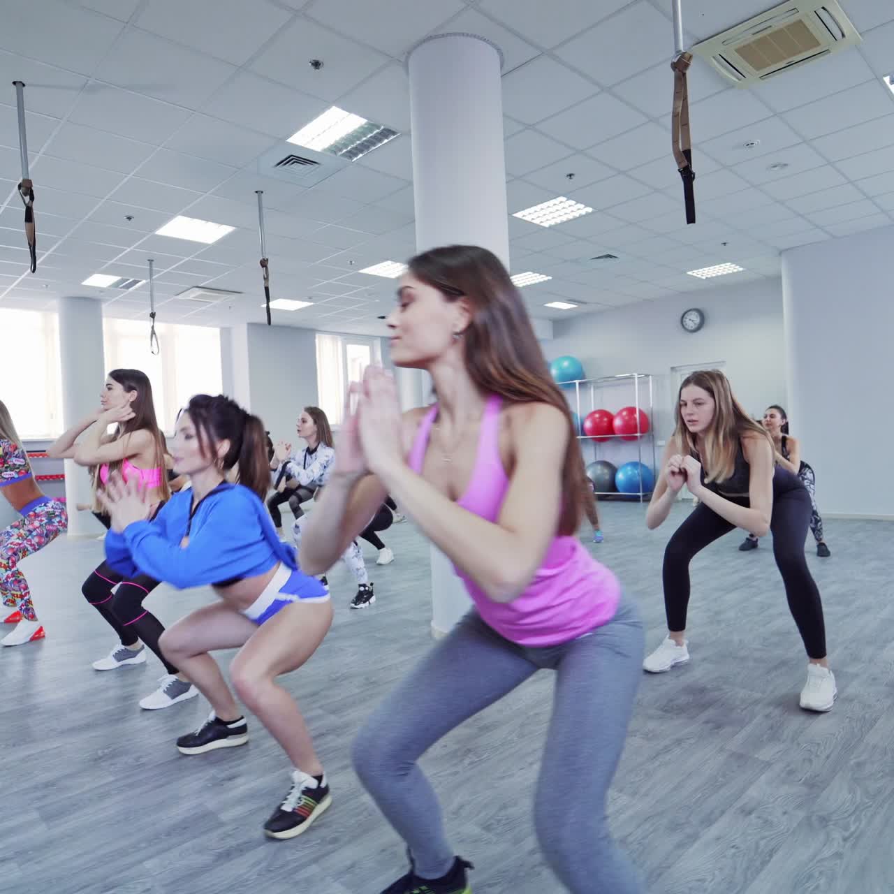 Group of sportive people in gym training