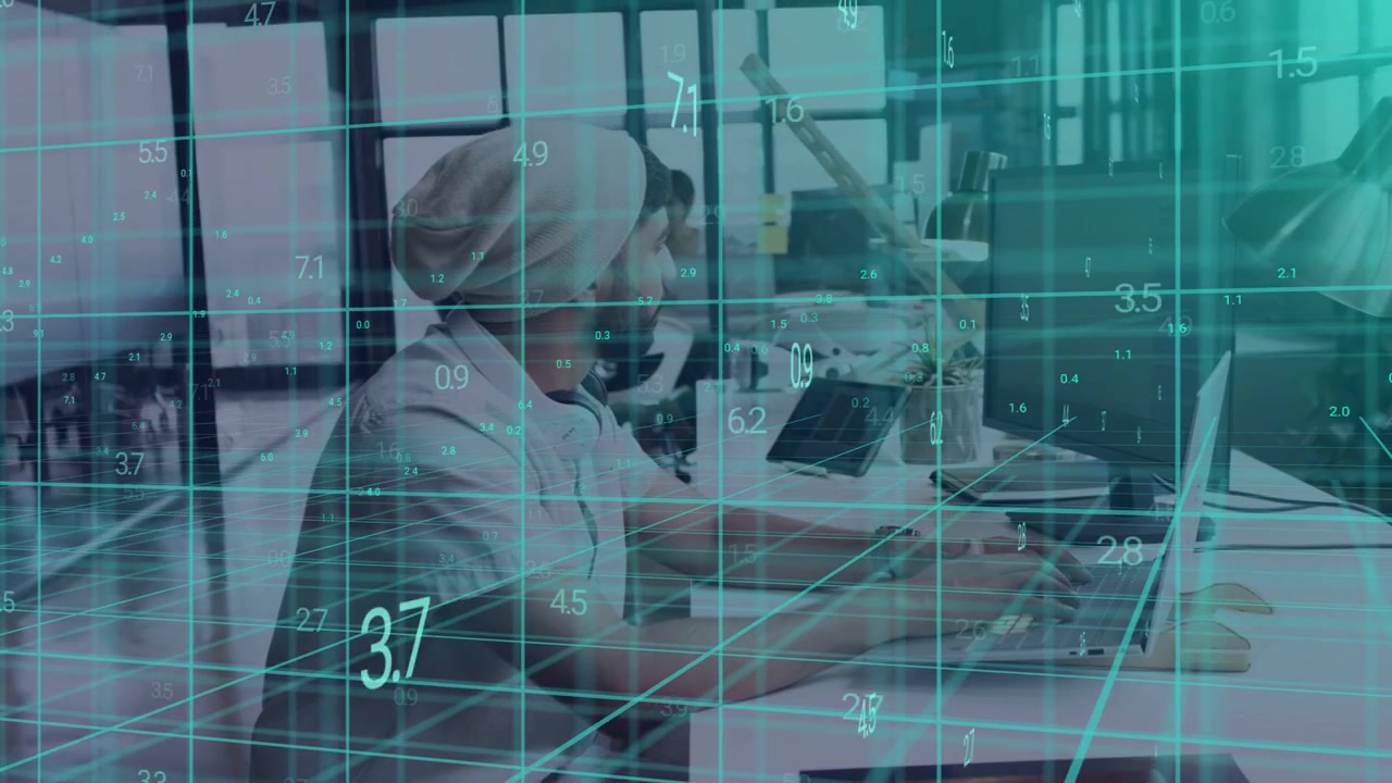 Adult man typing on laptop in tech workspace, teal 3D grid overlaying desk, monitoring live data