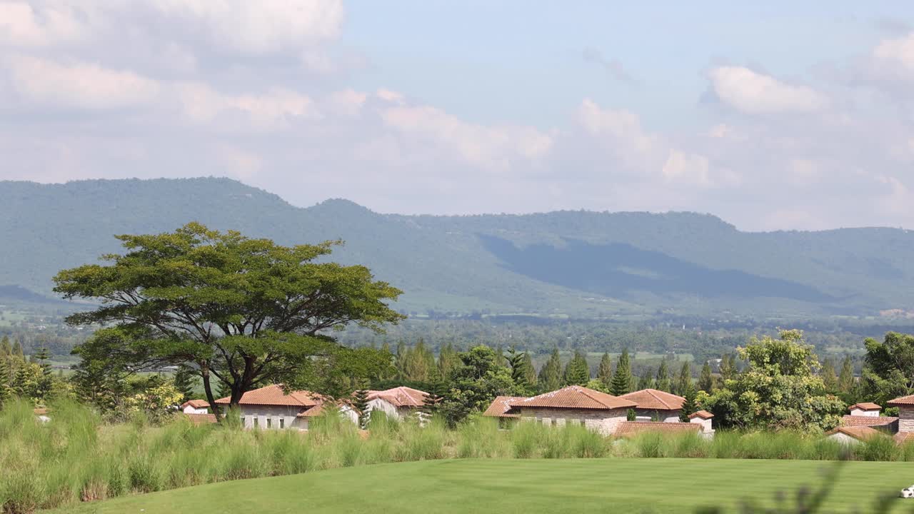 A tranquil village scene with expansive views.