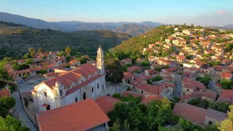 aerial centered around a church in lofou village, troodos mountains, cyrpus