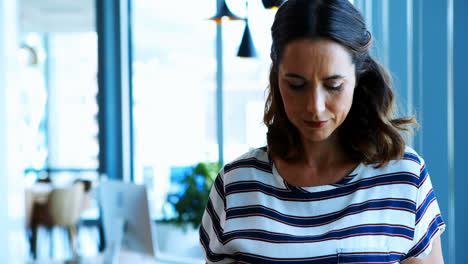 Female-executive-using-digital-tablet-in-office