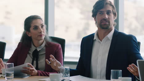 corporate business people brainstorming in boardroom meeting discussing strategy colleagues sharing ideas working on deadline collaborating in office 4k