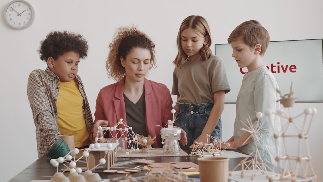 Teacher Looking at Finished Craft Model