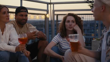 Group-of-friends-have-a-party-on-evening-in-top-of-the-roof.