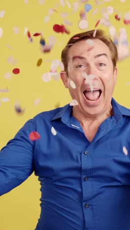 excited man celebrating with confetti