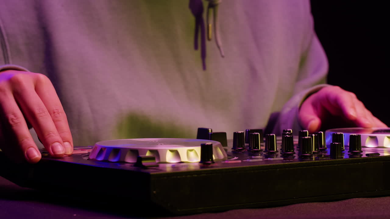 Vibrant DJ Mix Performance Closeup view of hands and equipment during a live music performance, city event, dj set in music techno club