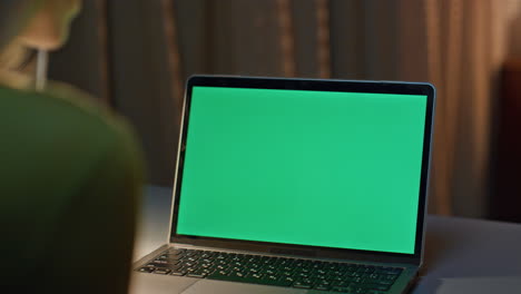 late worker looking chroma key laptop working on project remotely close up.