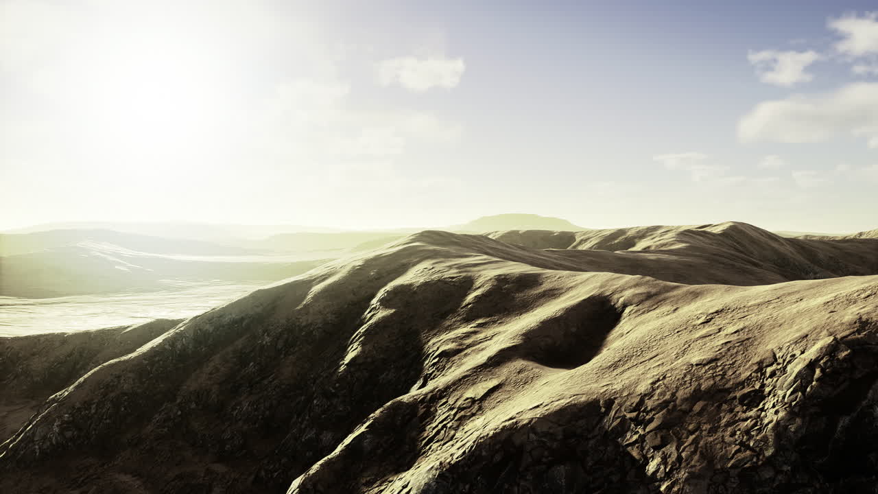 Serene hills bathed in golden sunlight during early morning hours