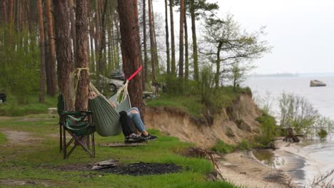 Relaxing by the River in a Forest Camping Spot