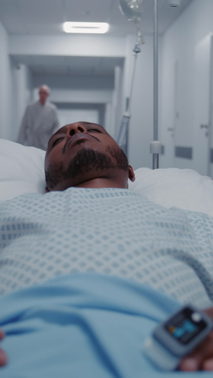 Doctor and nurse transport middle aged man to hosp 4k 2025 08 05 01 24 45 utc.mov | african american, care, catheter, caucasian