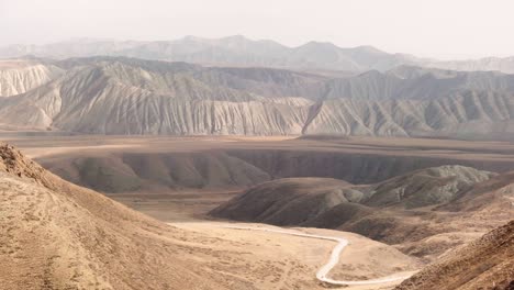 incredible mountain road passing through a valley exiting the mountain pass