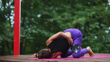 woman practicing yoga outdoors