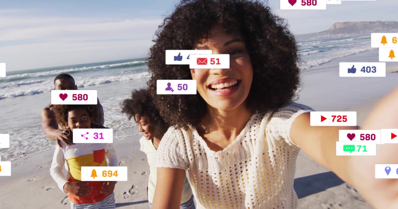 Woman holding phone leading family on beach sharing on social media as icons growing then receding
