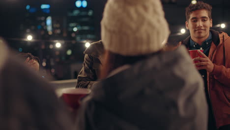 young-group-of-multiracial-friends-having-fun-dancing-playfully-together-enjoying-rooftop-party-at-night-laughing-celebrating-friendship