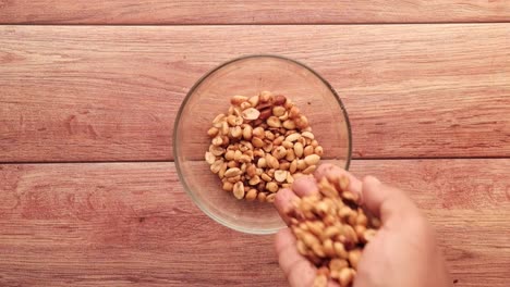 roasted peanuts in a glass bowl