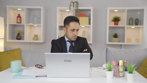 the man working from home gets angry, feels offended and sad.