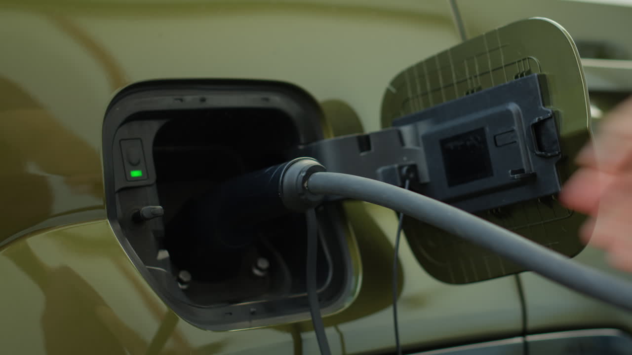 Close Up Shot Of Driver Recharging Ev Vehicle Battery Powering Electric Motor