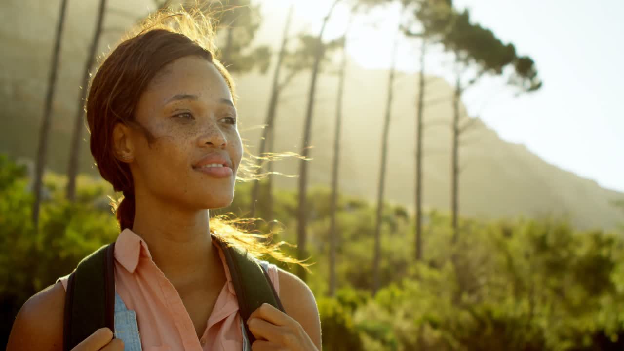 Female hiker standing in countryside 4k