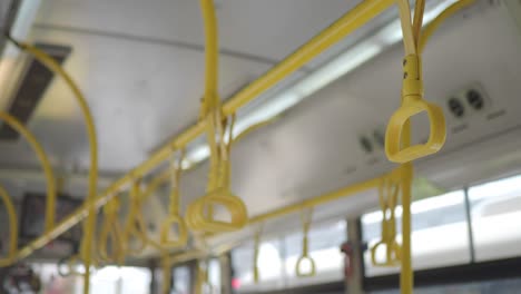 closeup of yellow handrails in a bus