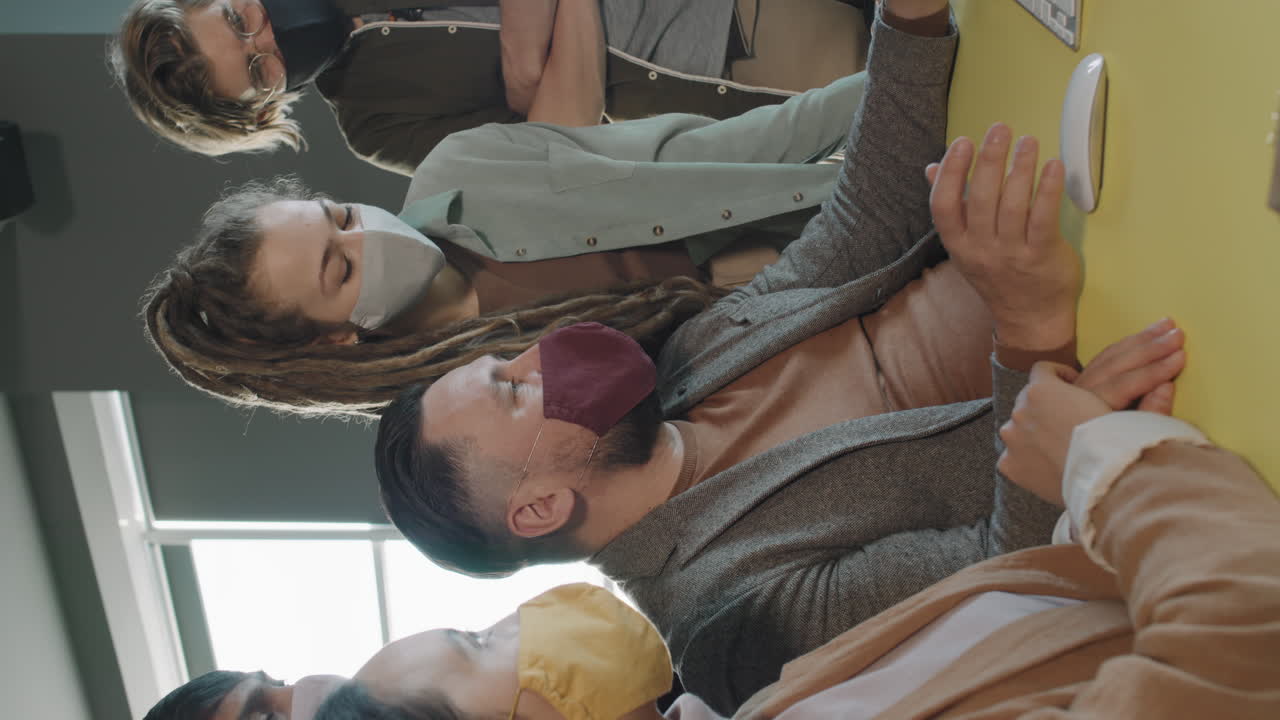 Group of Businesspeople in Face Masks Working