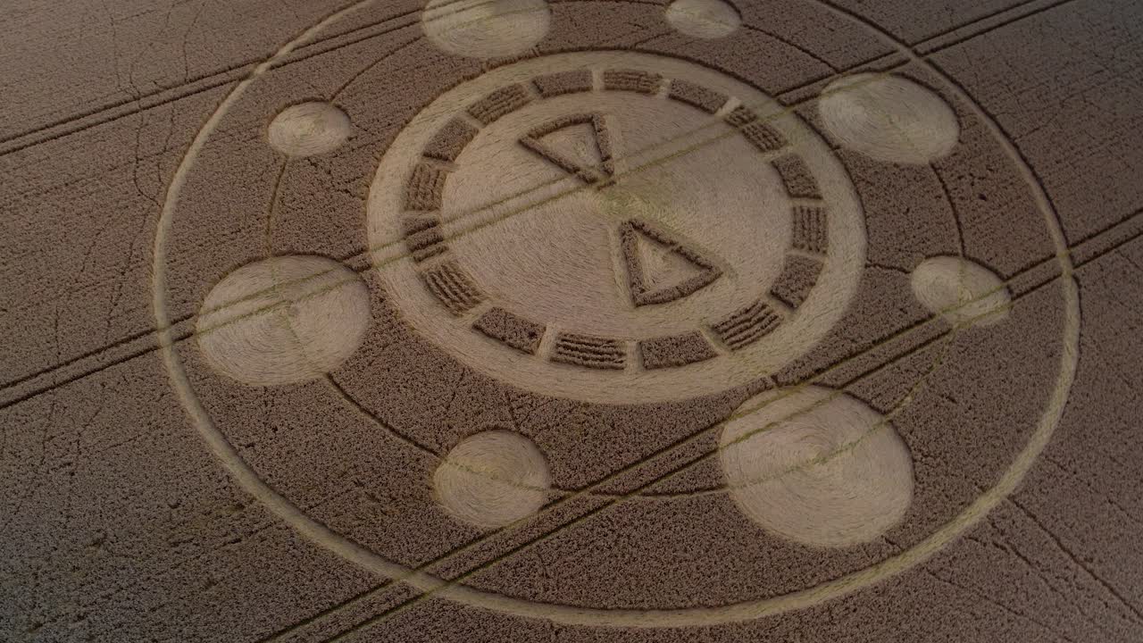 Swarraton barley field geometric crop circle pattern aerial rotating drone view from above
