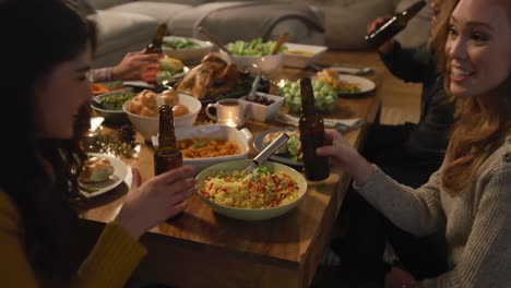 millennial adult friends celebrating thanksgiving together at home