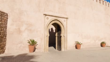 small archway in exterior wall of kasbah of the udayas