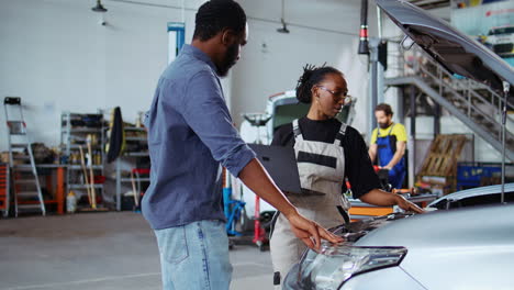 car technician listens to client request