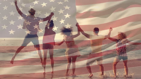 group of friends at the beach and the american flag for fourth of july.