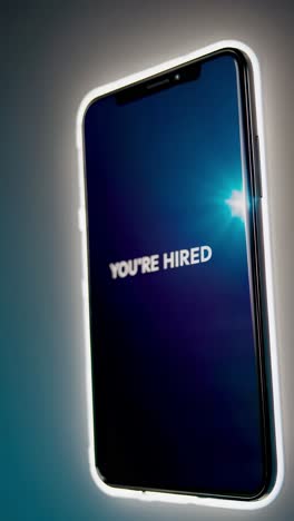 smartphone display showing "you're hired"