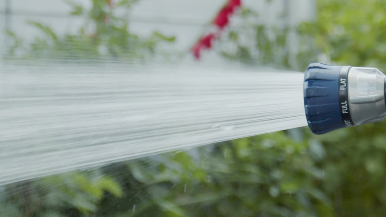 Garden plant sprayer sprays water in slow motion