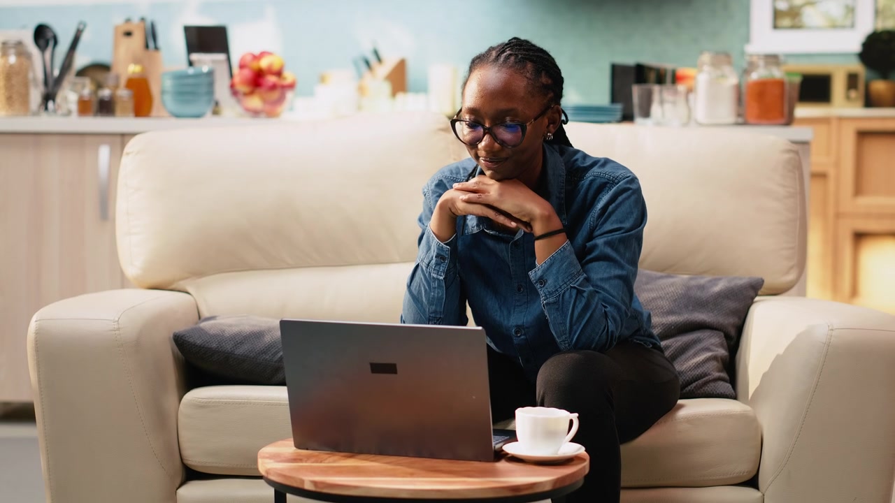 Adult woman working from home in cozy rustic living room