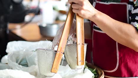 artisan stretching and folding dough into noodles