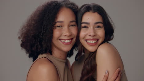 two smiling women hugging each other