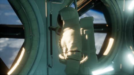 astronaut inside the orbital space station