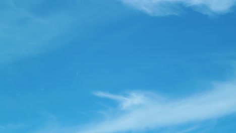 moving cloud time lapse at clear weather on blue sky, medium shot