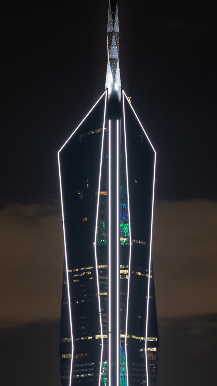 KUALA LUMPUR - 29 MARCH 2025 : Timelapse of the merdeka 118 building. from a high vantage point in vertical at night. the second tallest building in the world