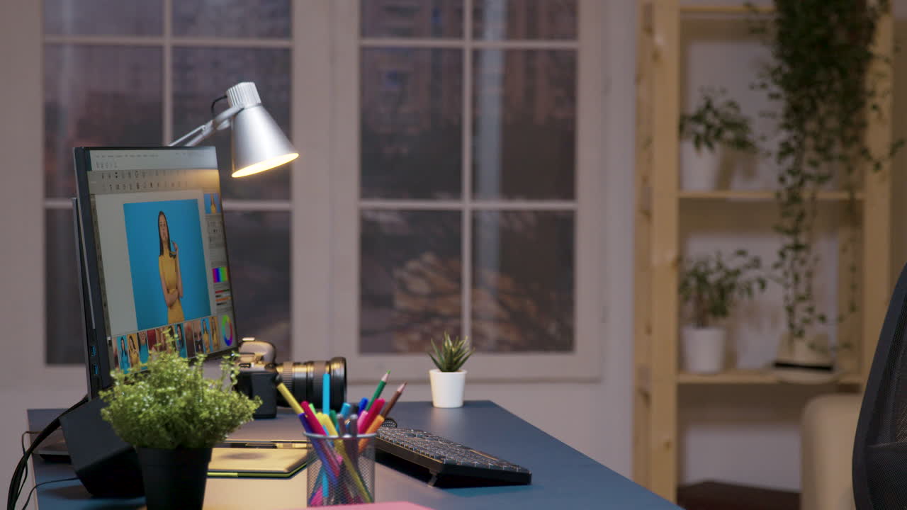 Man Editing Photos at His Desk