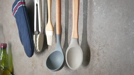 hanging kitchen utensils and oven mitt