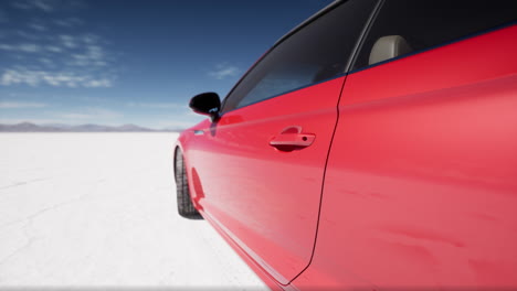 red audi coupe on a salt flat