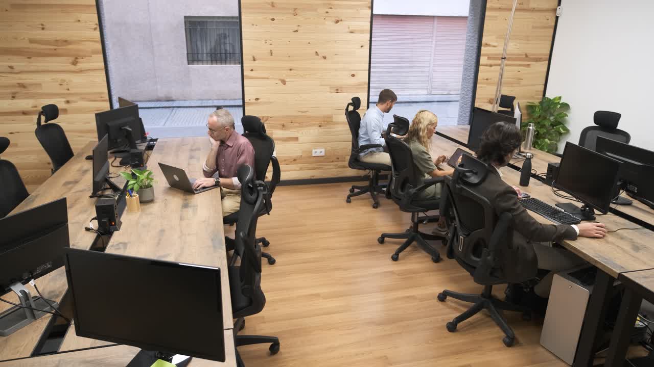 Group of coworkers working on project in office
