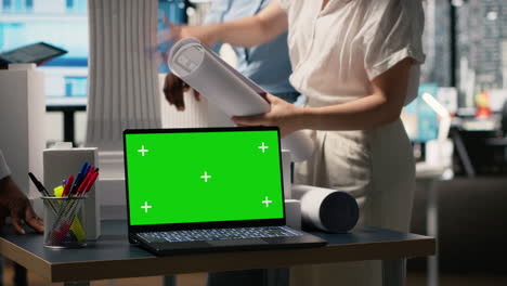architects working on design with laptop with green screen
