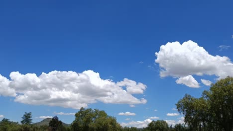 slow panning shot showing bright blue skies with clouds during summer in mexico