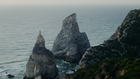 coastal rocks and waves at sunset