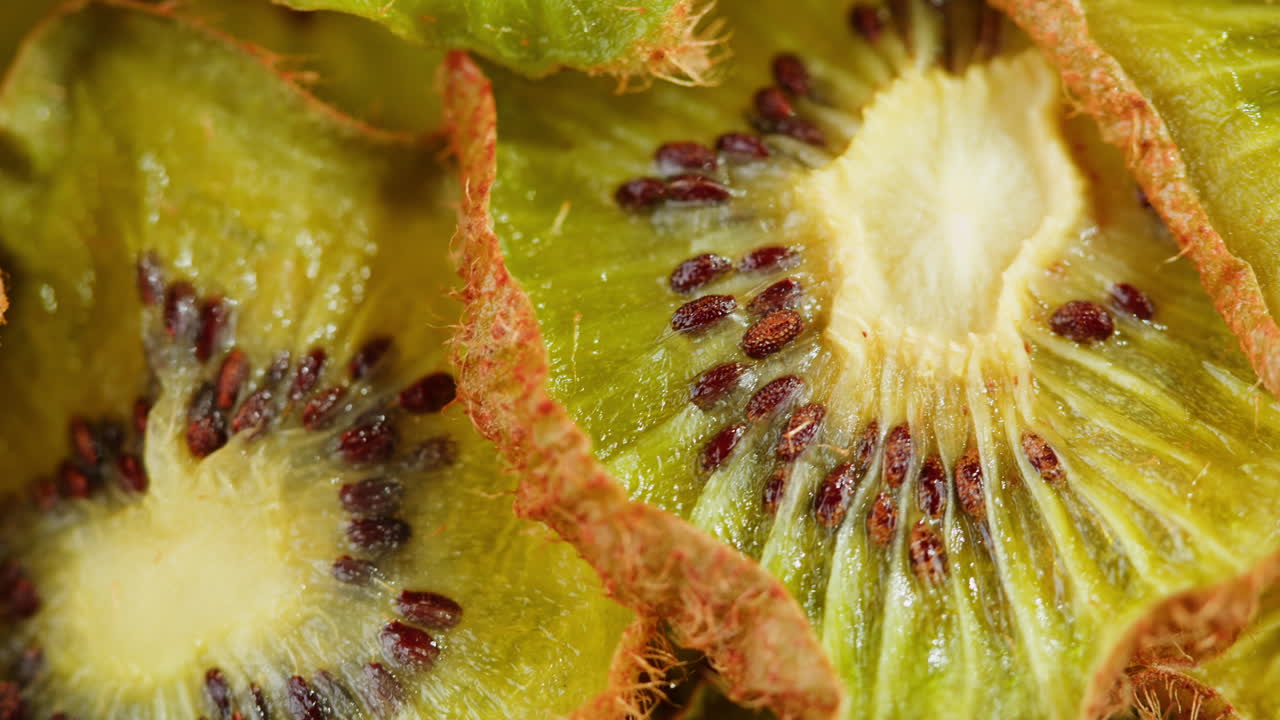 kiwi slices close up background of green, fresh fruit texture.