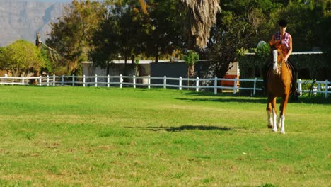 Woman-riding-horse-in-ranch-4k